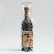 Sticlă veche Aleatico Vin Desert 1964 în ambalaj Lion-gri, etichetă vintage.
