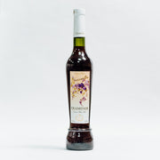 Vin desert Traminer Naturalles 500ml Lion-gri sticlă verde și etichetă florală.